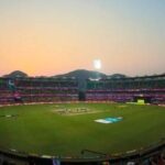 T20 cricket stadium at sunset